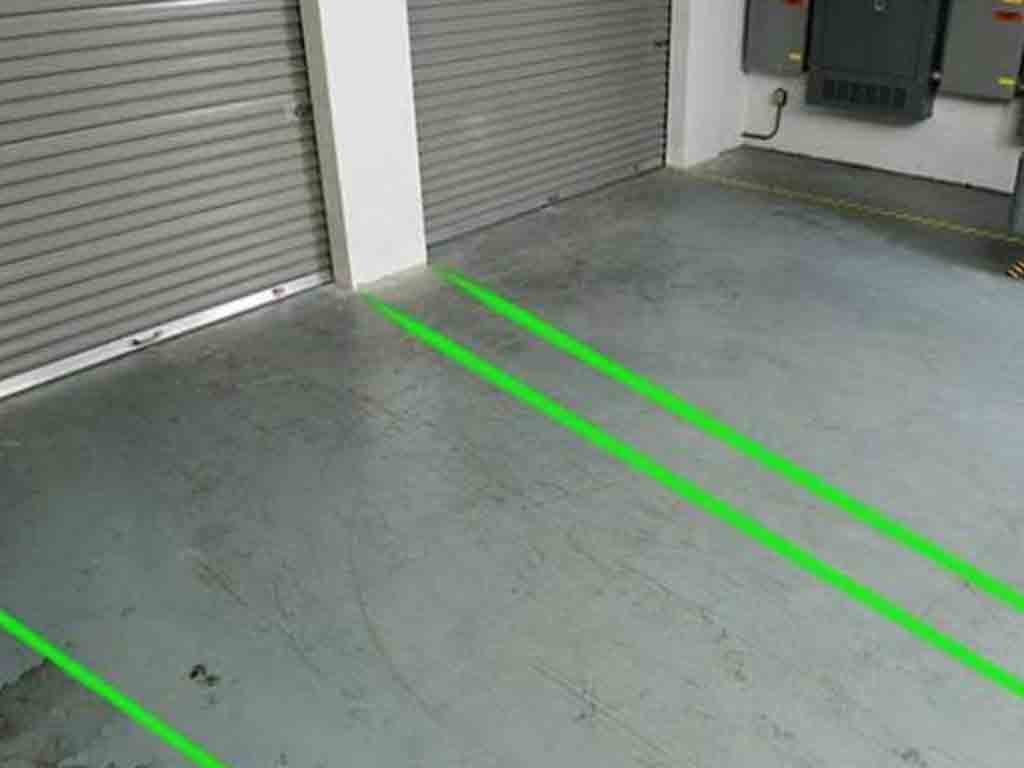 Forklift boundary marking with laser line projector in warehouse